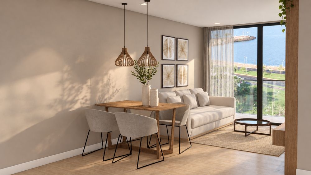 Comedor y estar del departamento modelo, con salida a la terraza y vista a la costanera